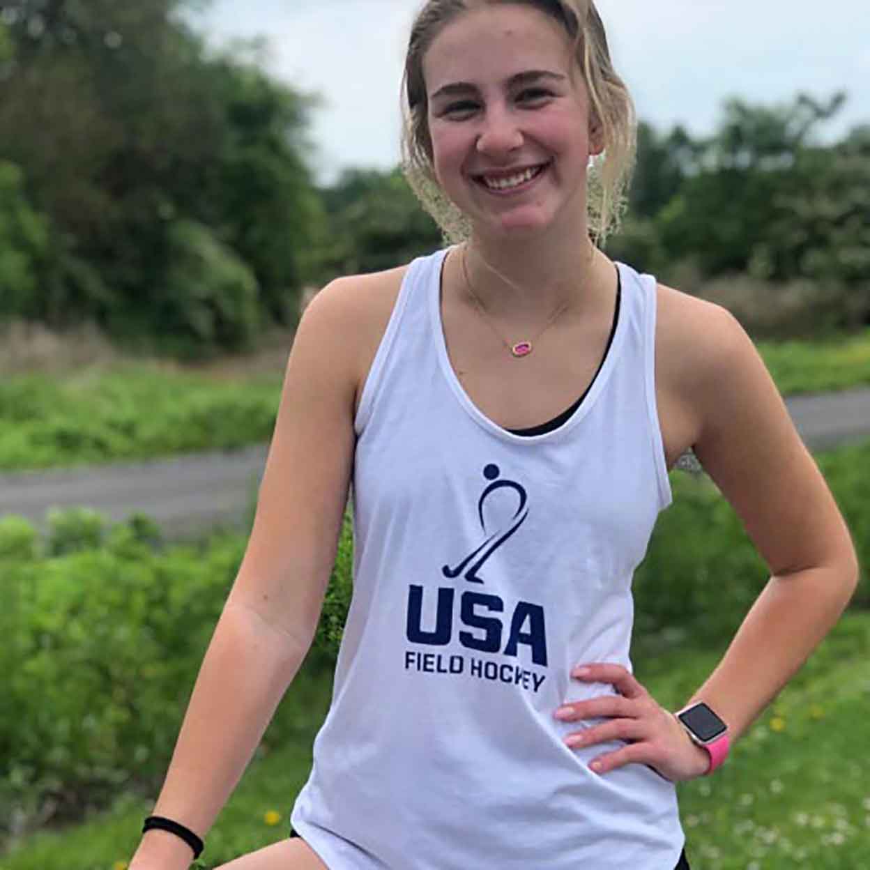 smiling woman wearing the USA Field Hockey Ladies Vintage Tank
