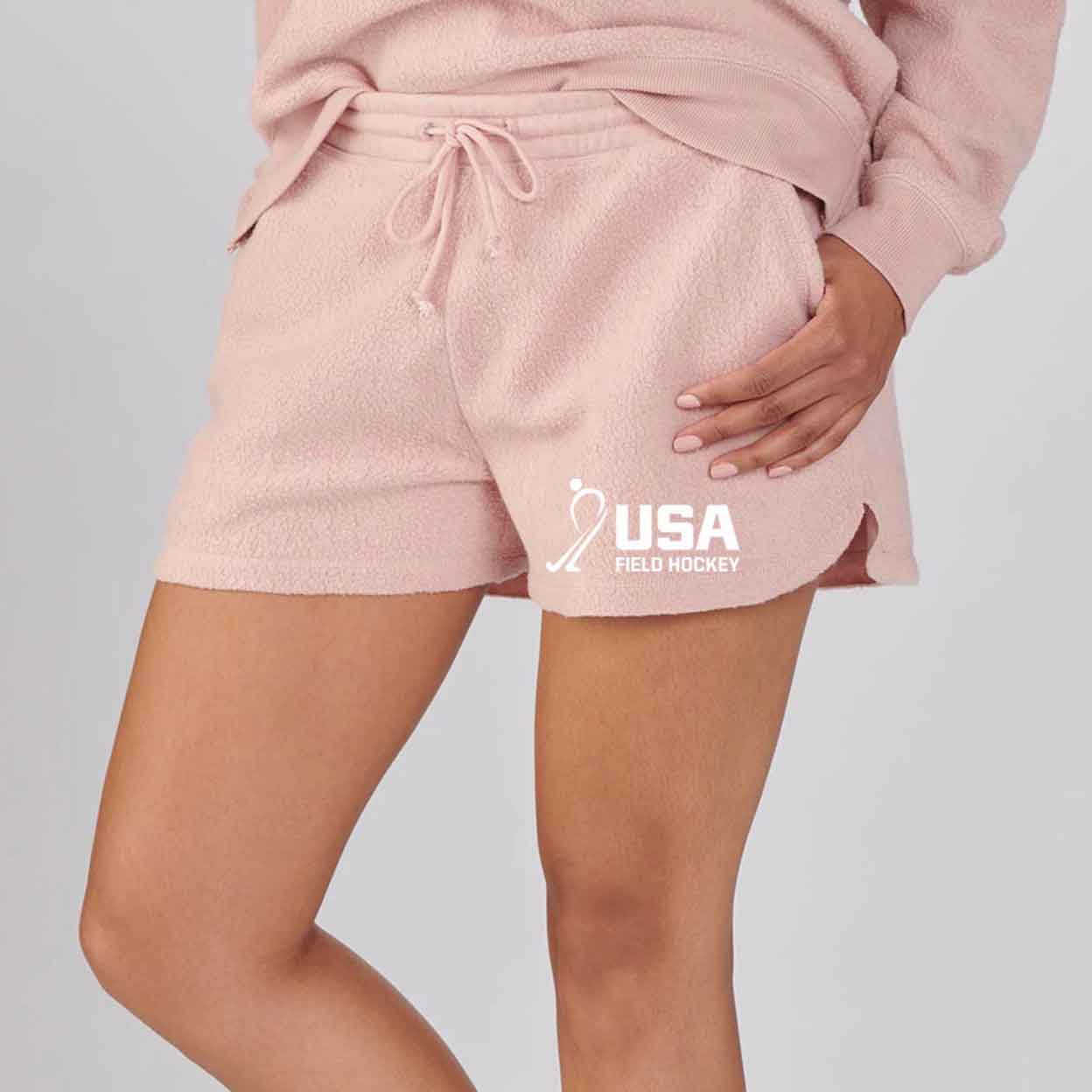 Person wearing the USA Field Hockey Fleece Out Shorts.
