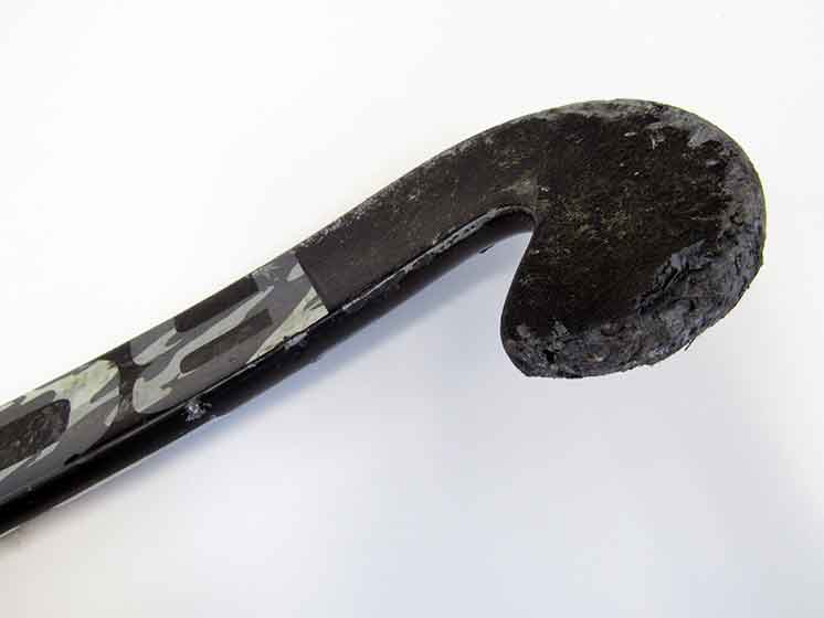 Field hockey stick toe with big chunks out of it.