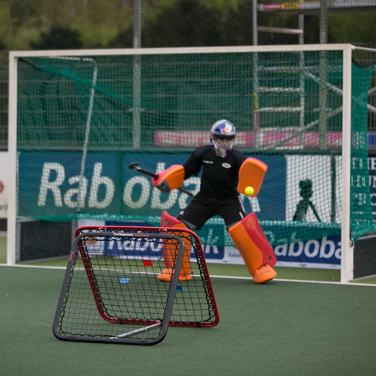 Goalie using the Crazy Catch Wild Child 2.0 Rebounder for practice.