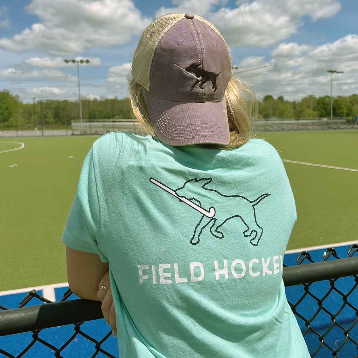 Model wearing the Field Hockey Dog Tee and hat