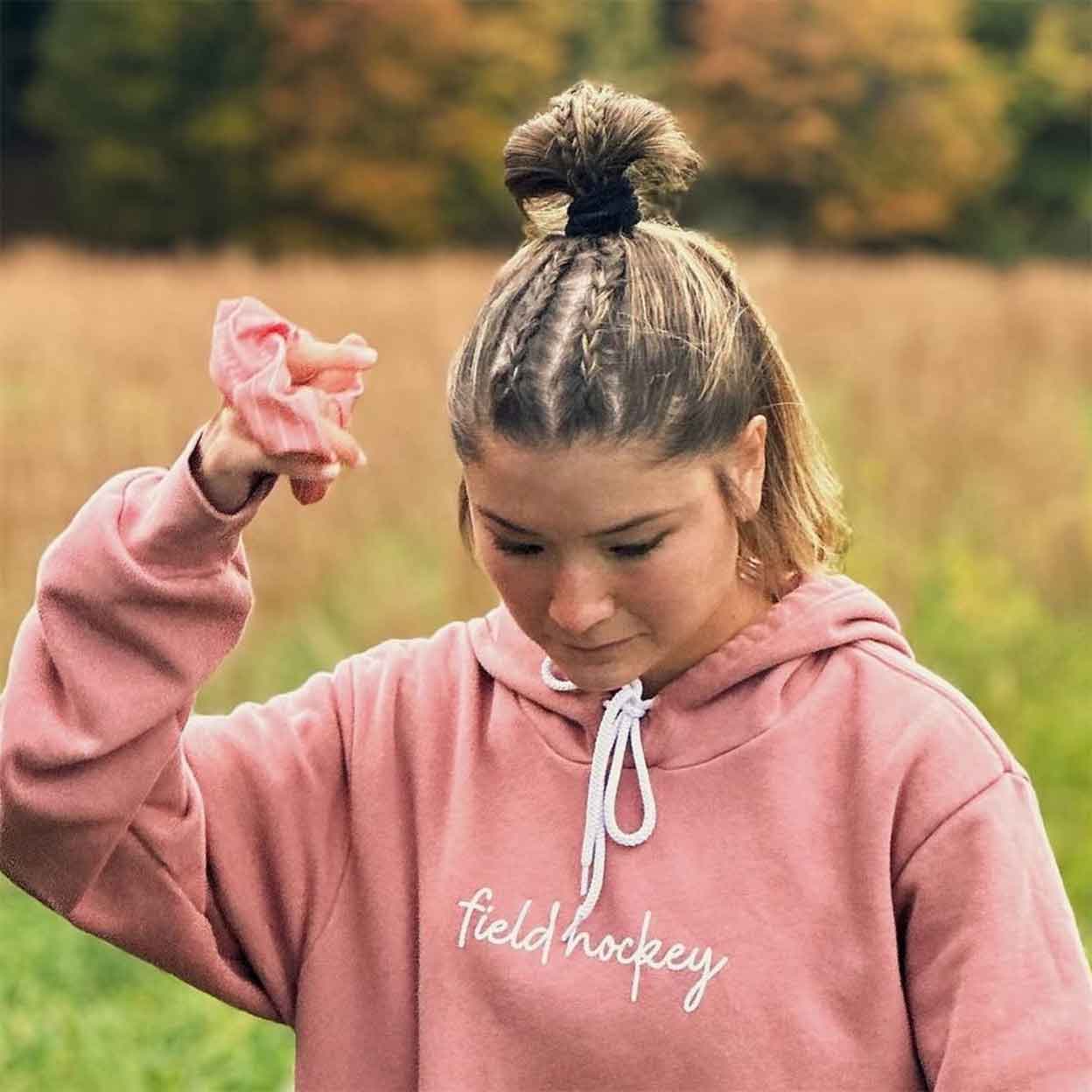 girl holding the Field Hockey Scrunchie in her hand
