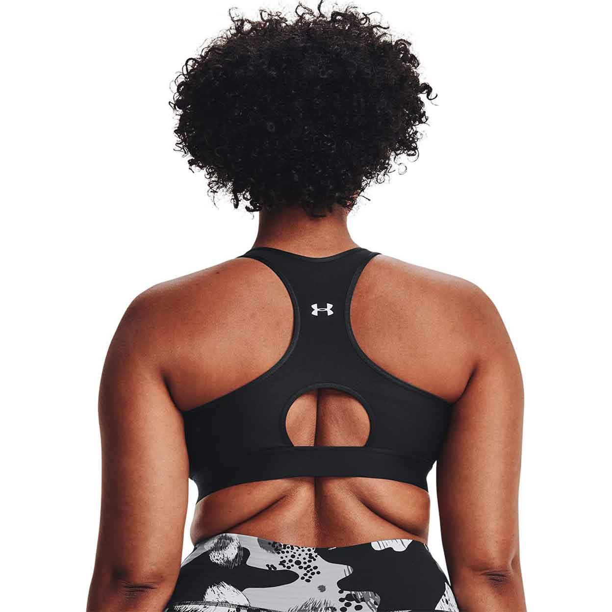 Back of the model wearing the Under Armour Mid Keyhole Bra