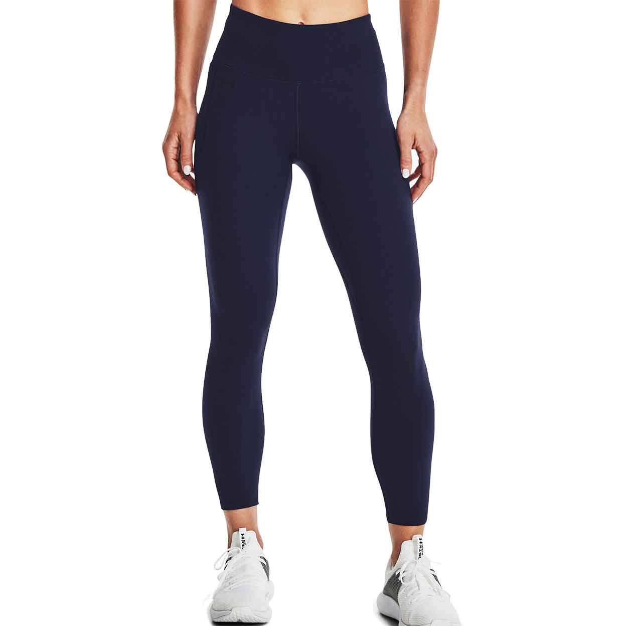 Front of model wearing the Under Armour Women's Motion Ankle Leggings with hands to her side.