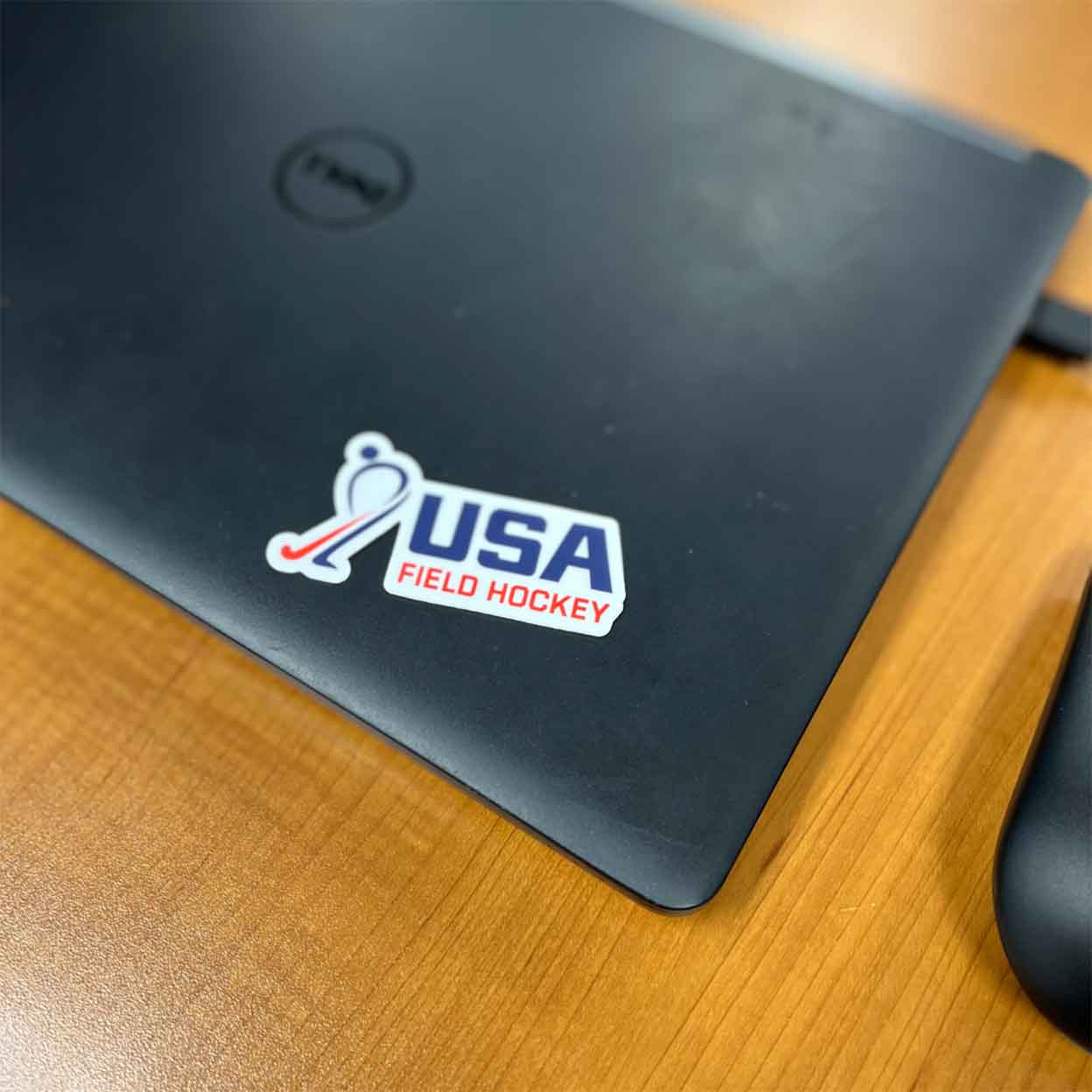 USA Field Hockey Sticker on a laptop.
